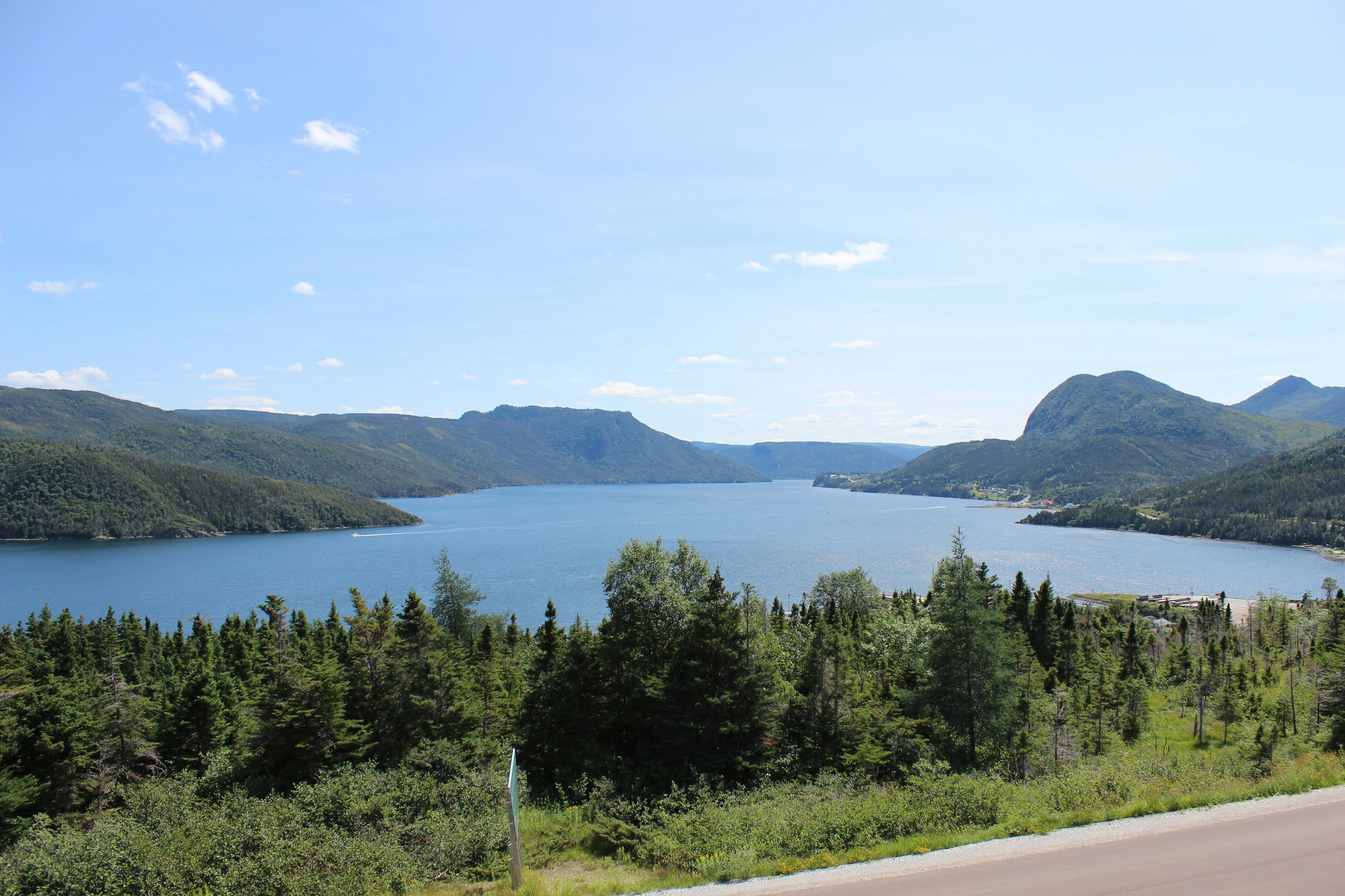 a scenic view of a lake surrounded by mountains