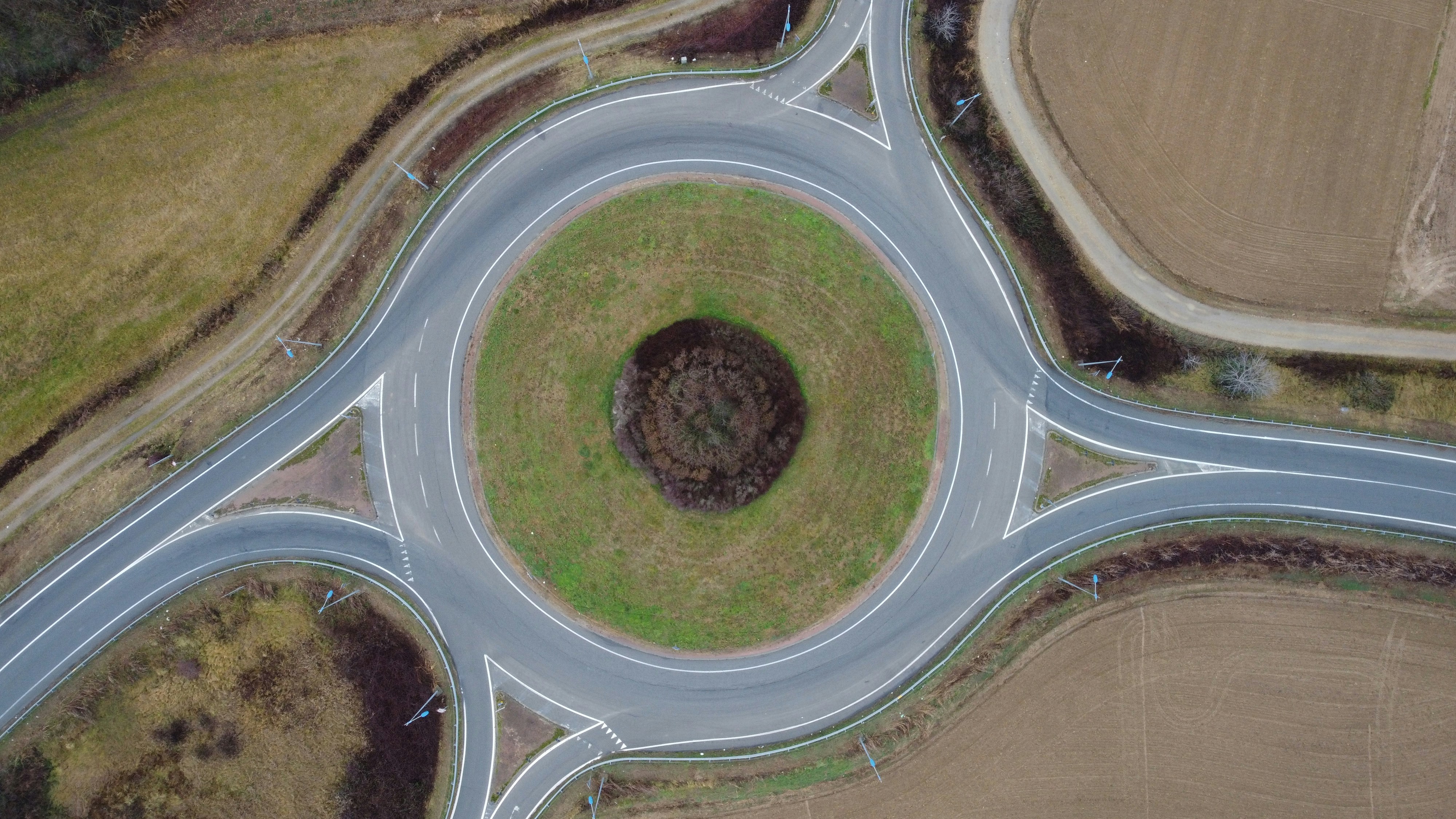 an aerial view of a road intersection in the middle of nowhere