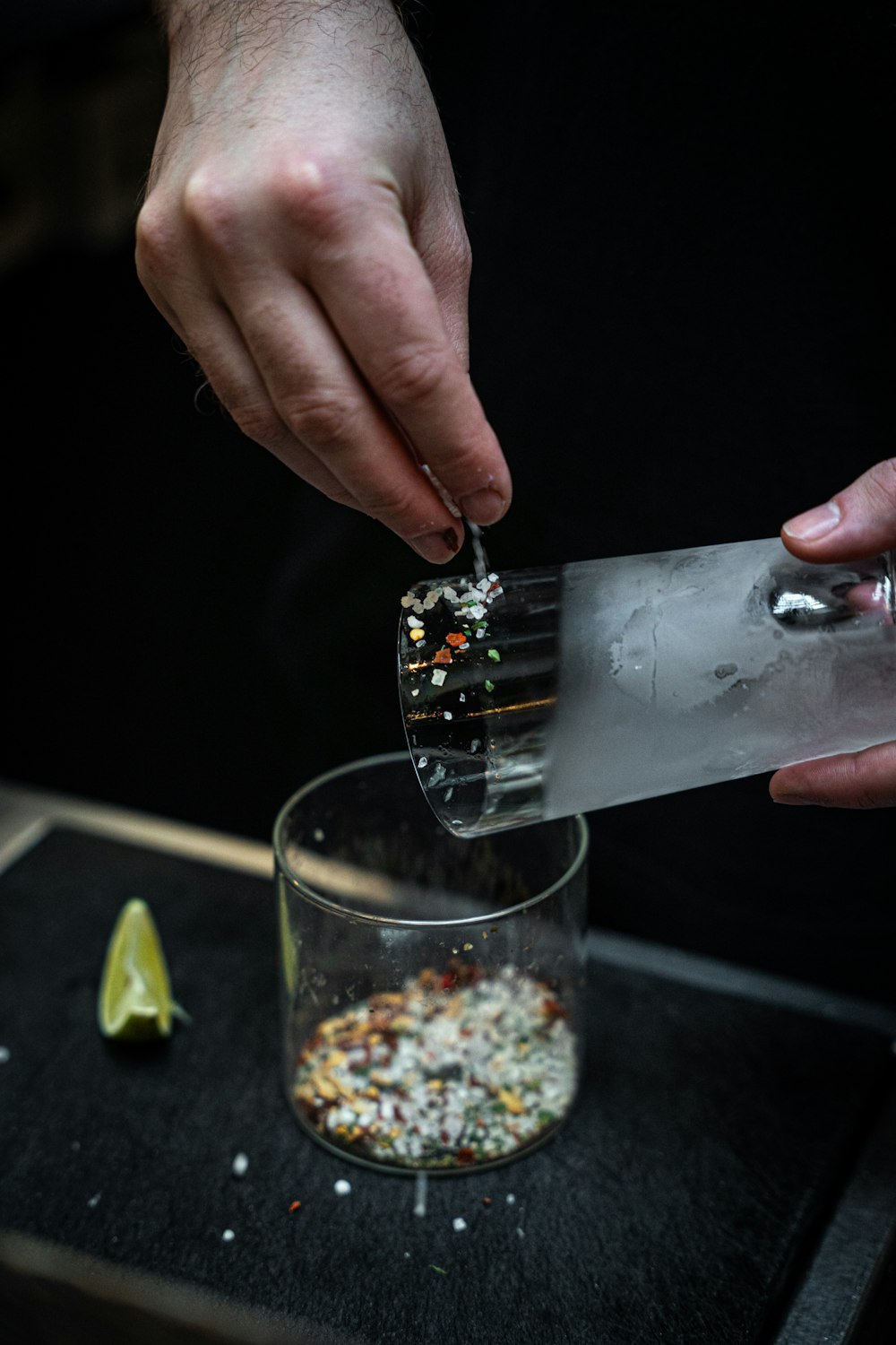 a person is preparing food in a glass