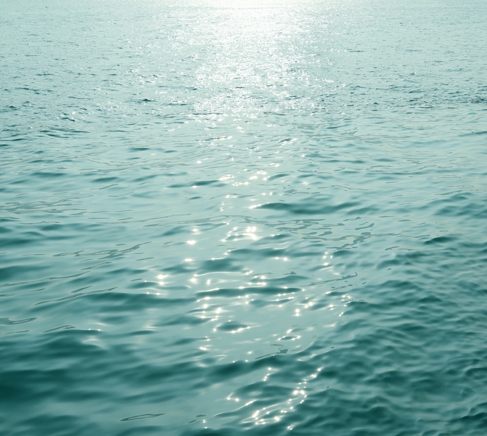 a body of water with a boat in the distance