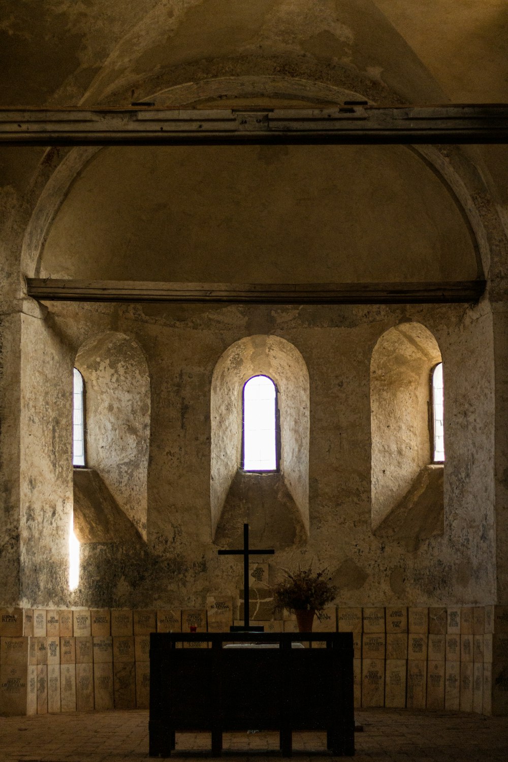 a church with a cross in the middle of it