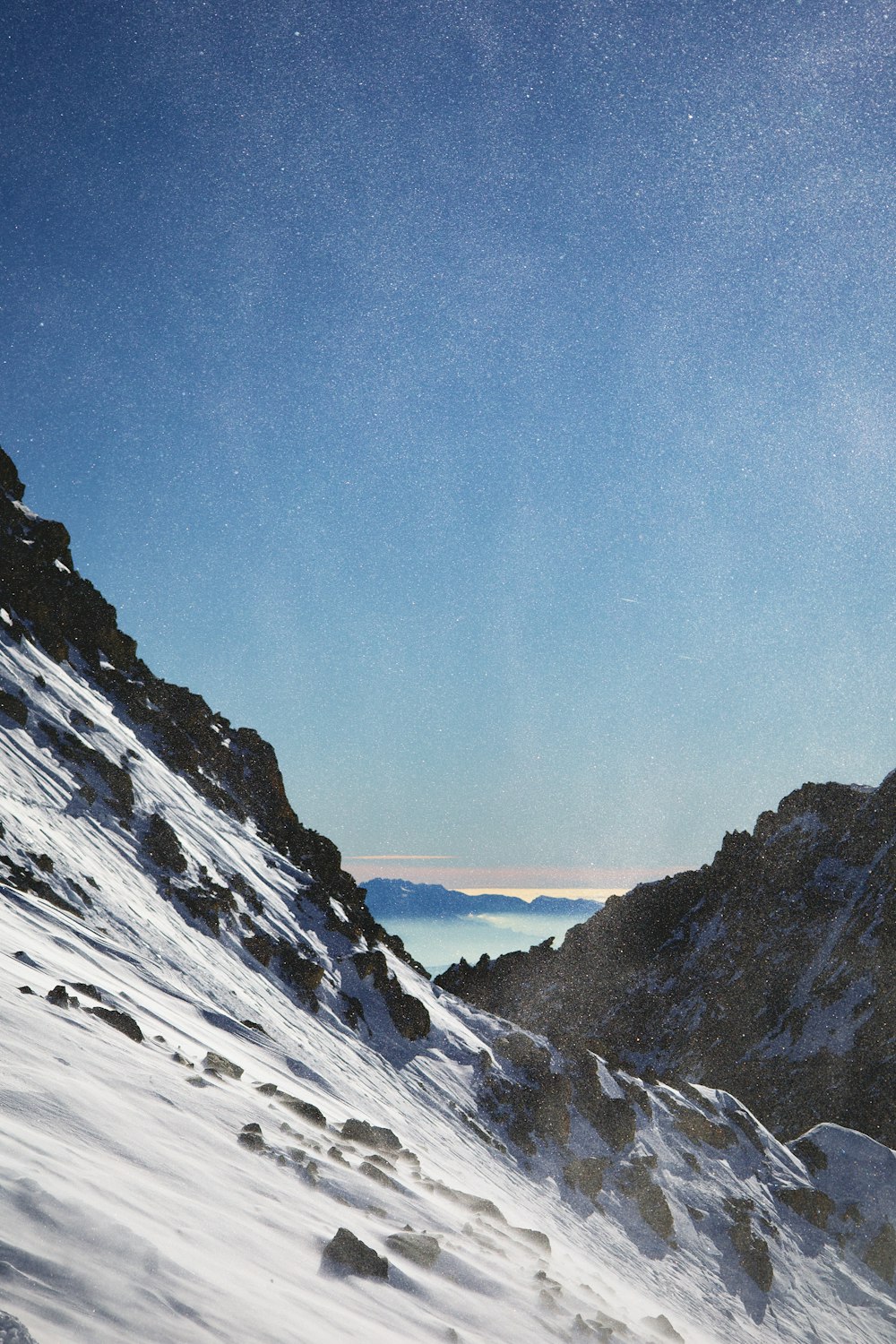 a man riding skis down a snow covered slope