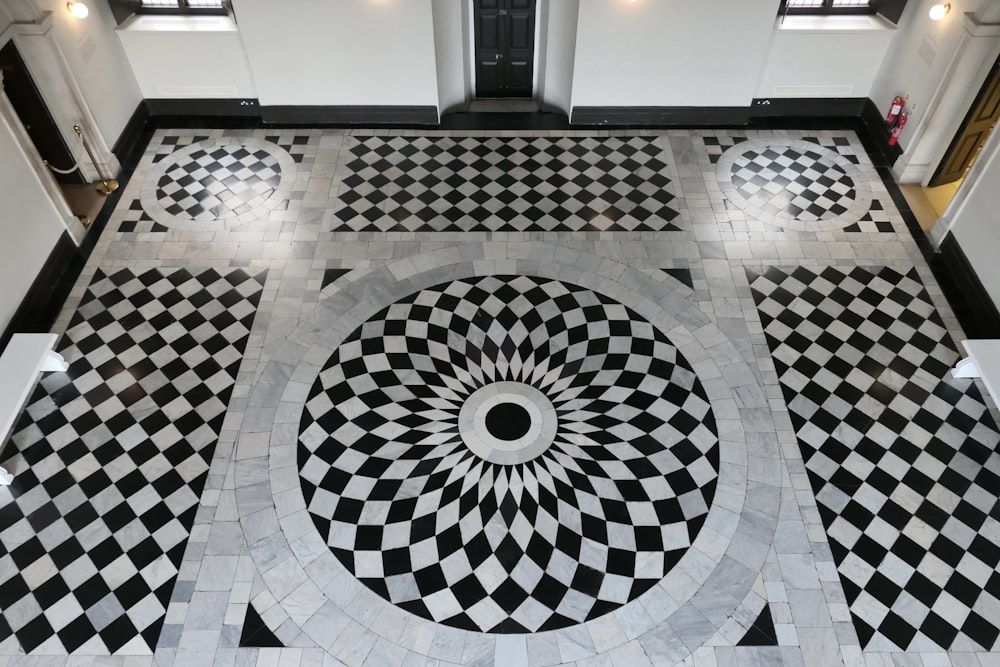 a black and white checkered floor with a circular design