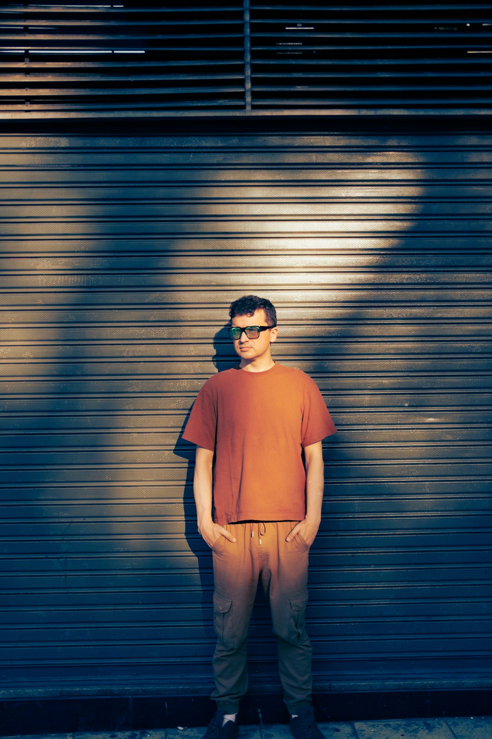 a man standing in front of a garage door