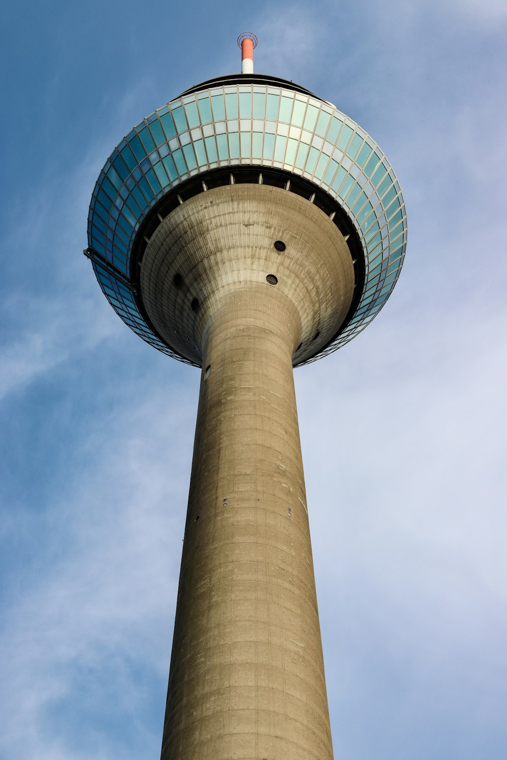 a tall tower with a blue sky in the background