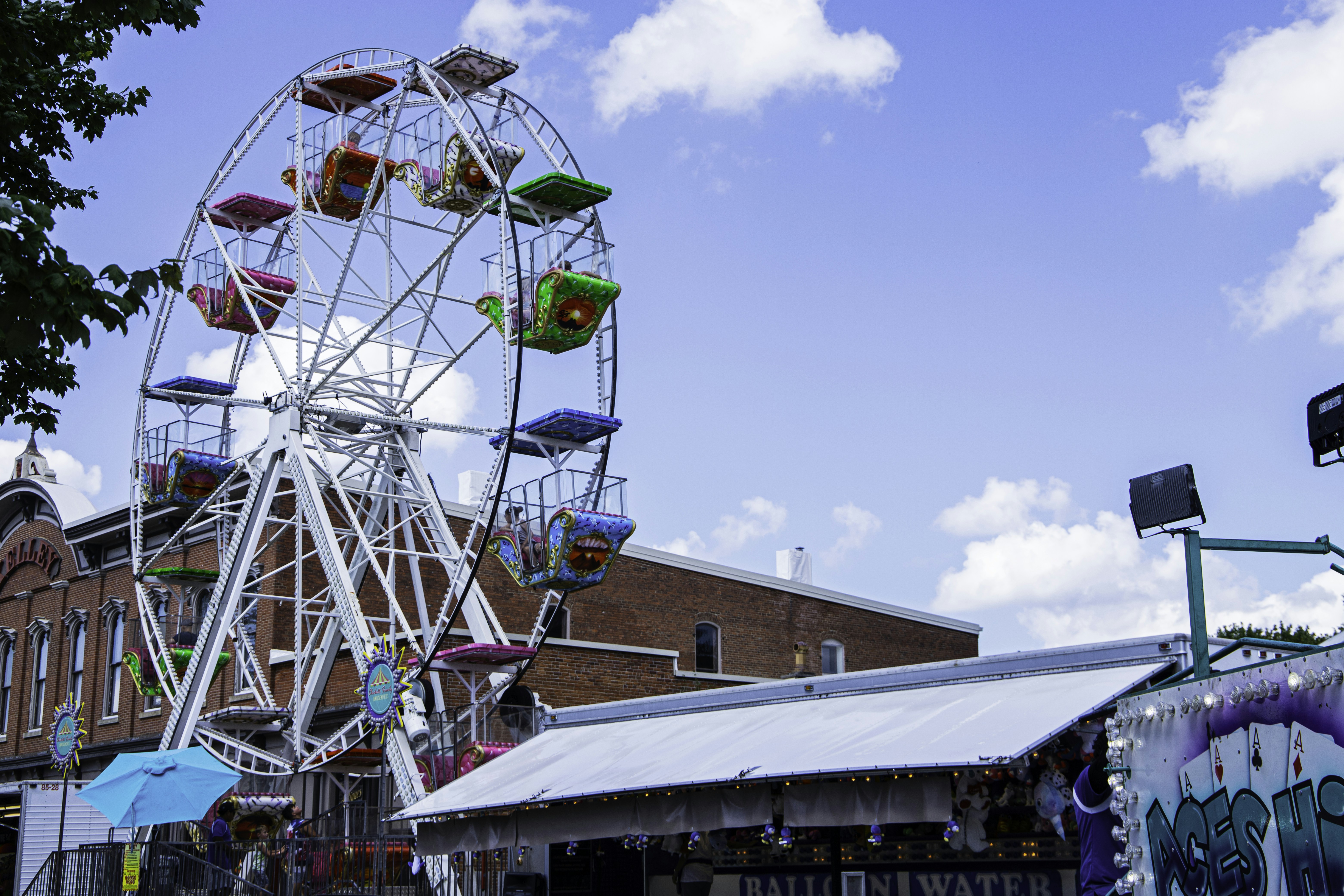 a ferris wheel sitting in front of a building