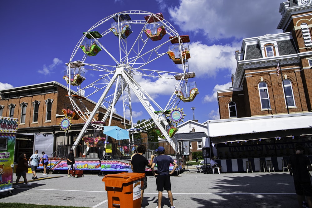 a large ferris wheel sitting in the middle of a street