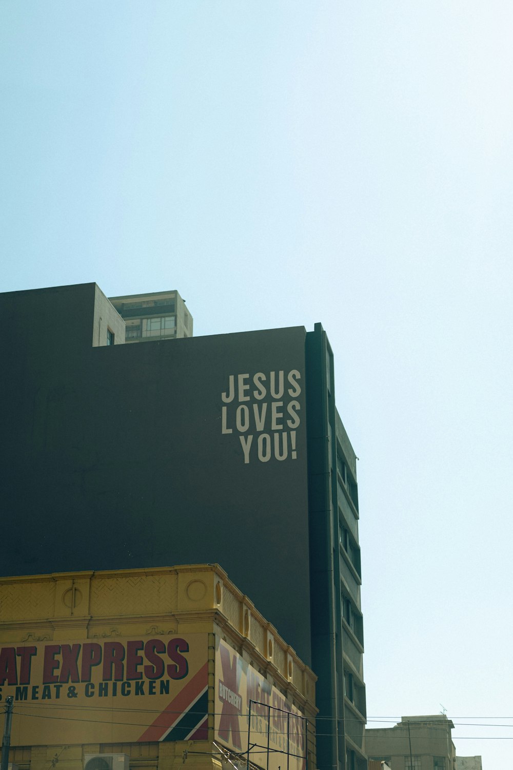 a tall building with a sign on the side of it