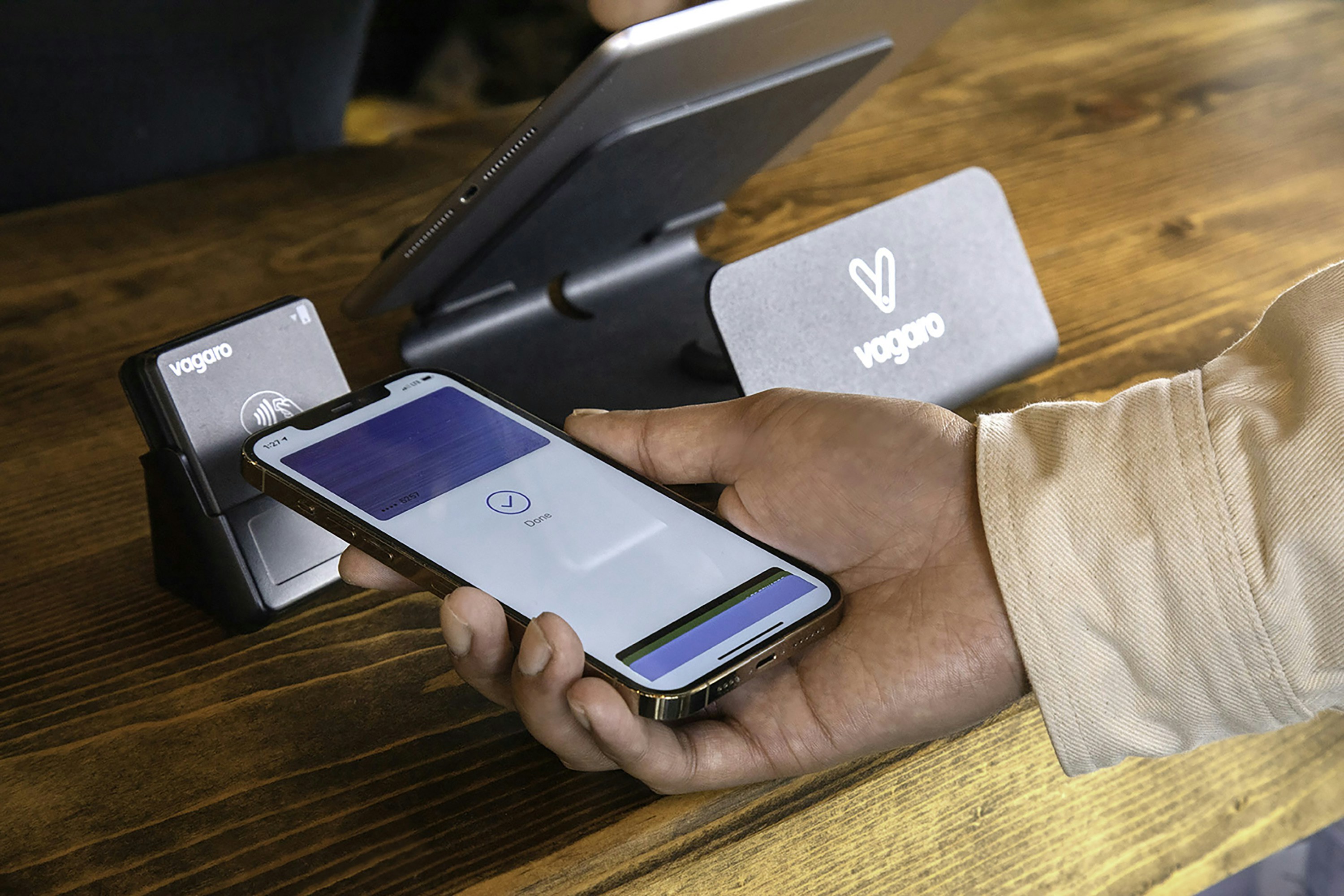 A customer is making a transaction using Apple Pay with the Vagaro contactless card payment system. The sleek and modern payment process introduces a touch of convenience, enhancing the overall checkout experience.