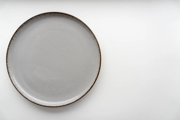 Grey speckled dinner plate with dark rim — cone-10 reduction stoneware