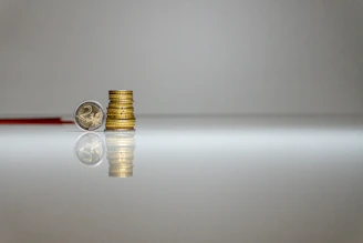 a stack of coins sitting on top of a table