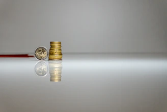 a stack of coins sitting on top of a table