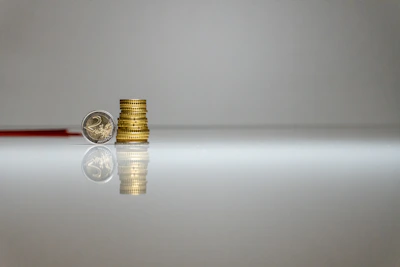 a stack of coins sitting on top of a table