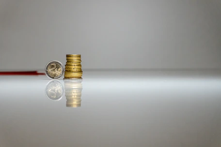 a stack of coins sitting on top of a table