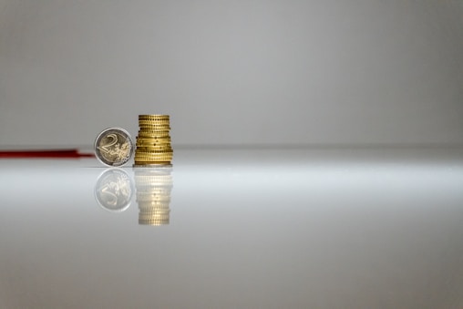 a stack of coins sitting on top of a table