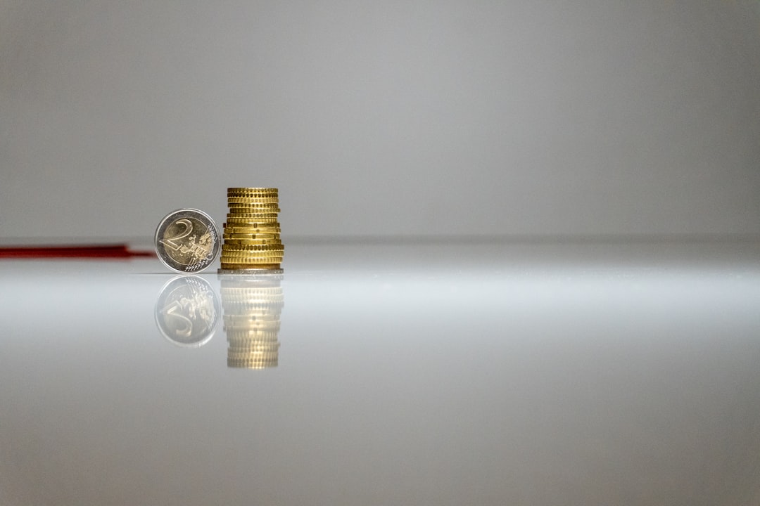 a stack of coins sitting on top of a table,