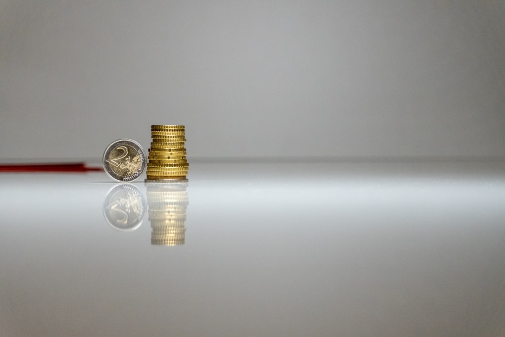 a stack of coins sitting on top of a table