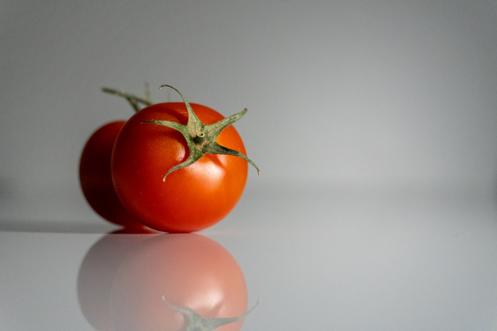 a close up of a tomato on a table