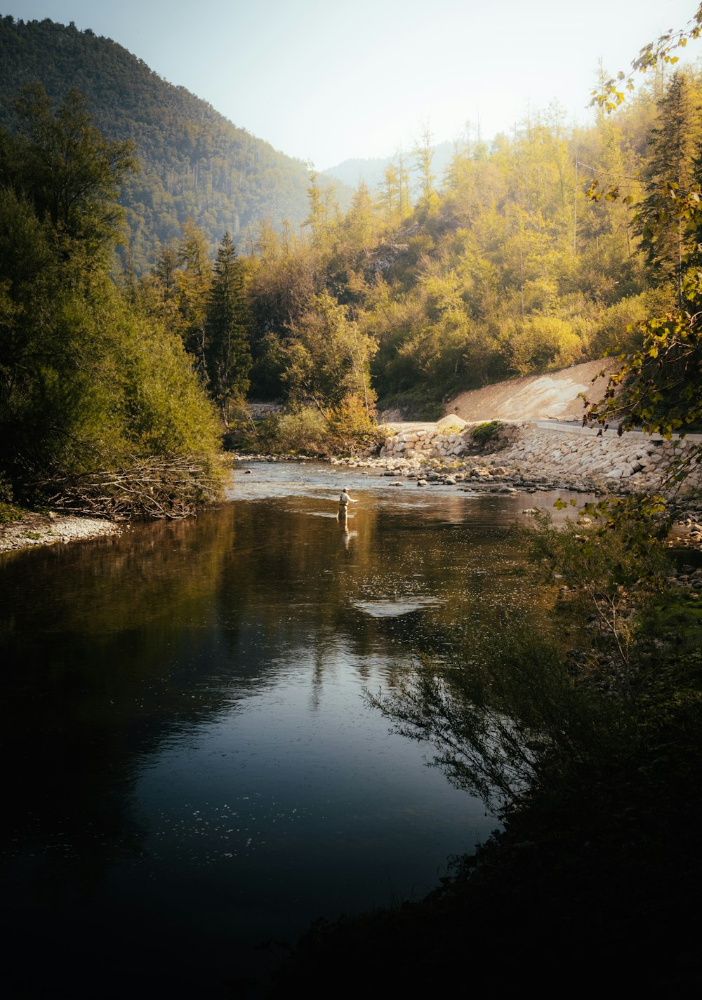 a man standing in the middle of a river