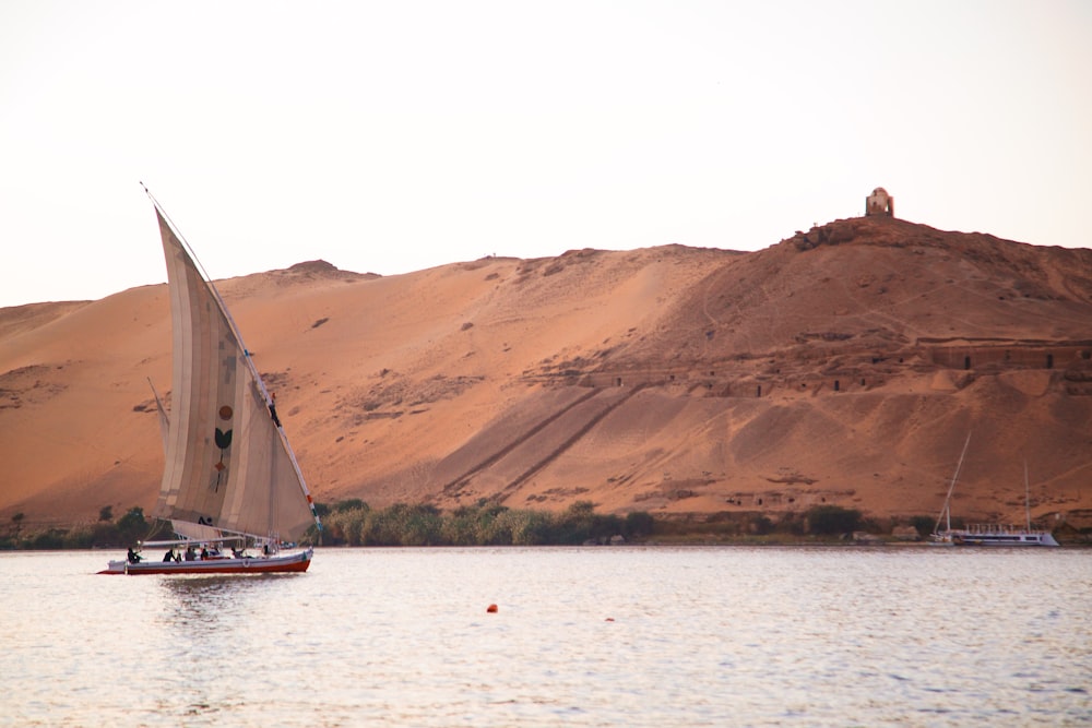 a sailboat in the middle of a body of water