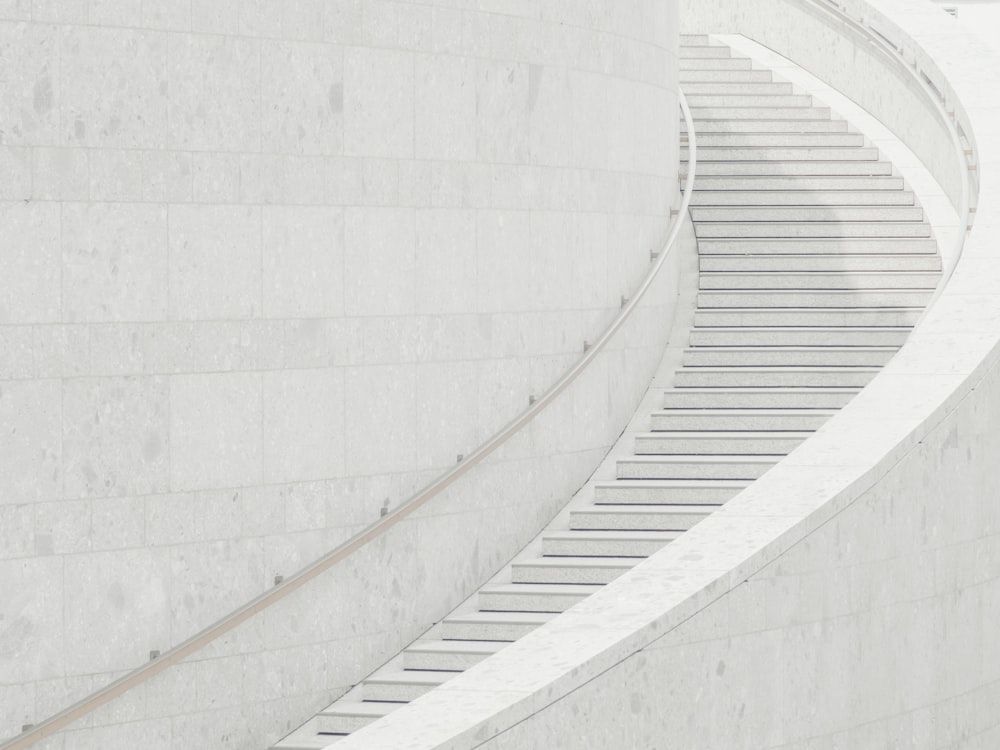 a man riding a skateboard down a set of stairs