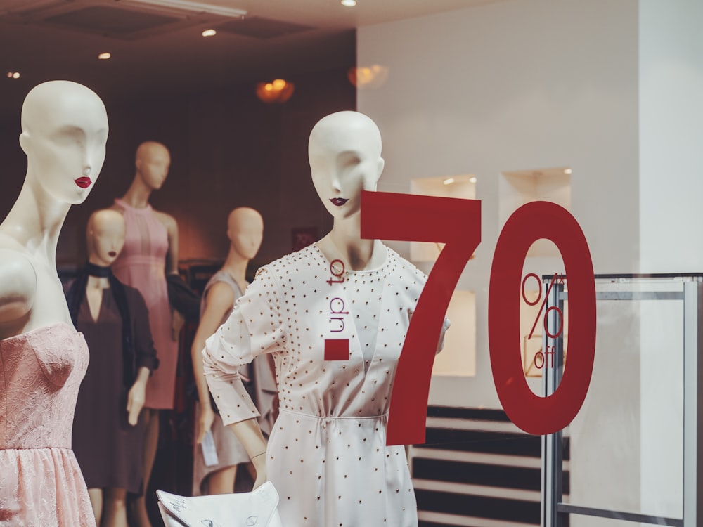 a display of mannequins in a store window