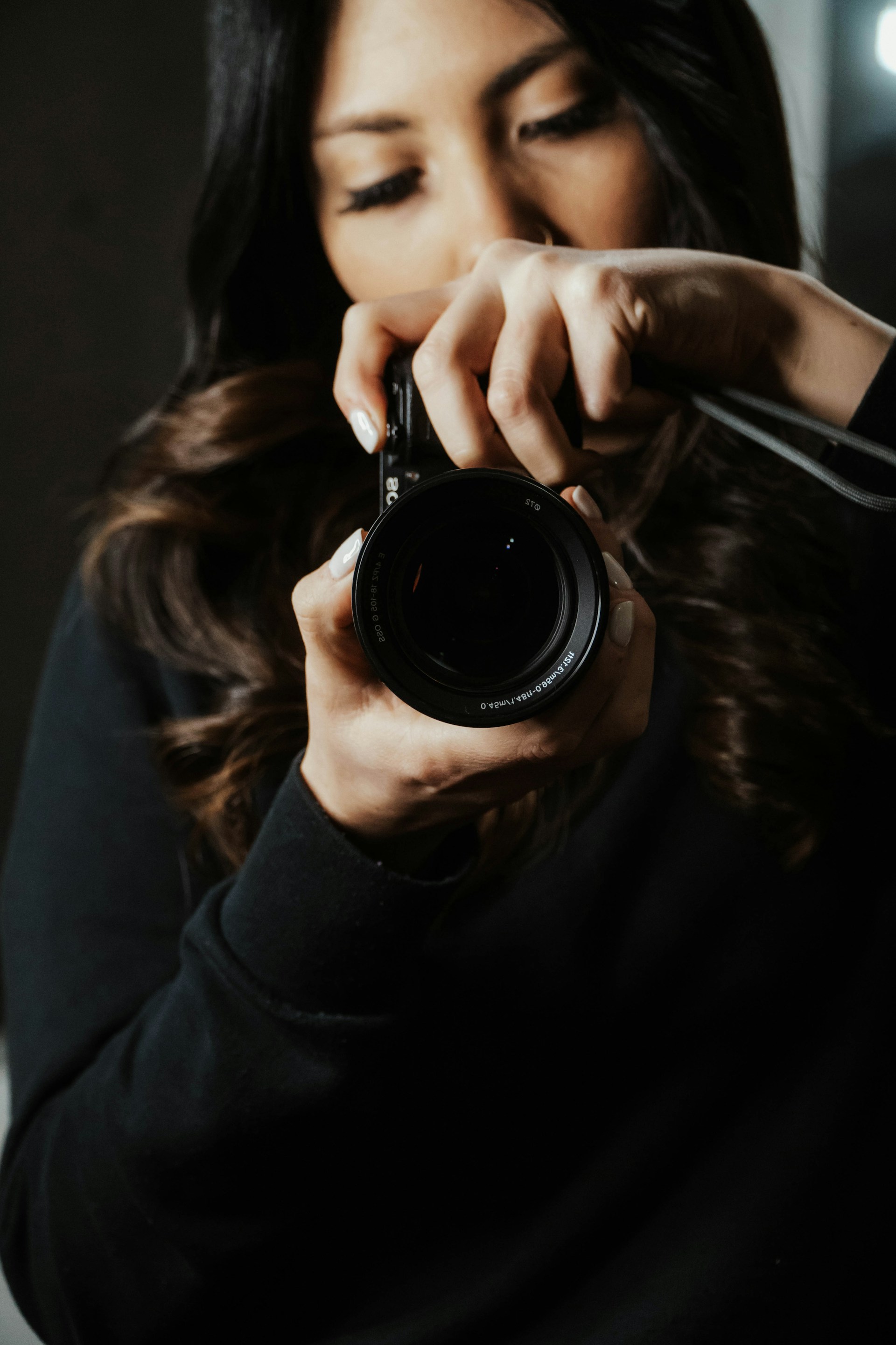 a woman taking a picture with a camera