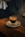 a cup of coffee sitting on top of a white plate