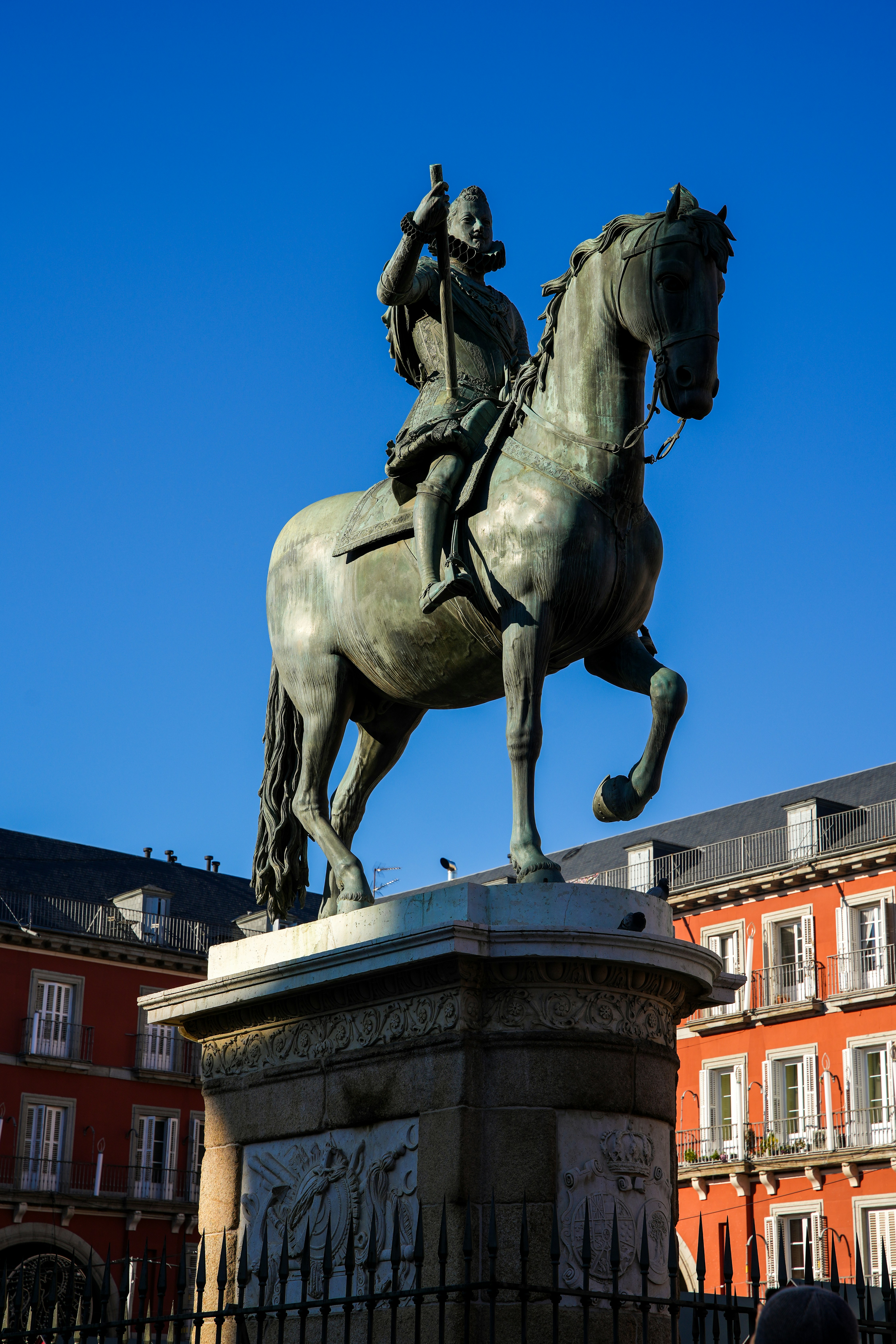 a statue of a man riding a horse