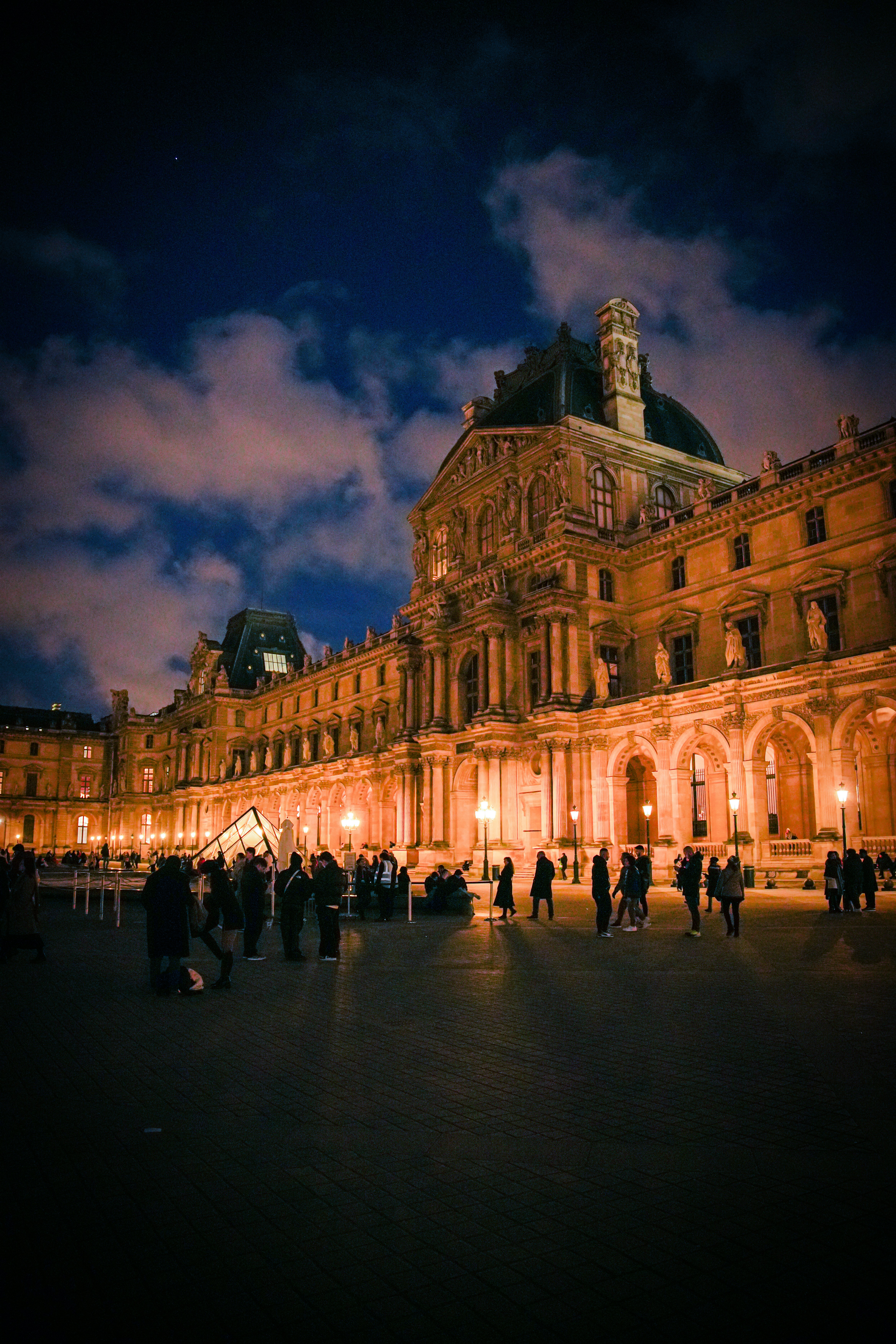 a group of people standing in front of a building