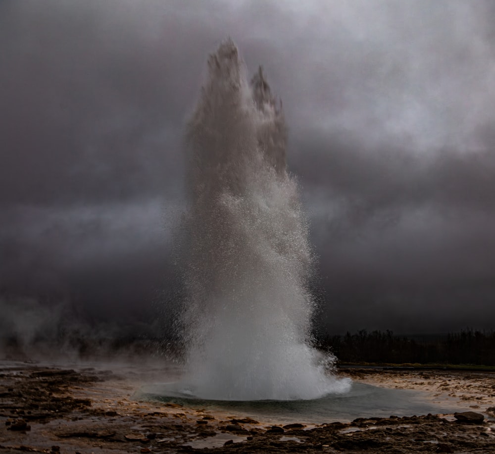 a geyser spewing out water into the air