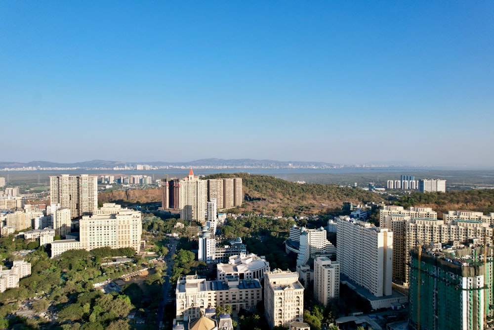 an aerial view of a city with tall buildings