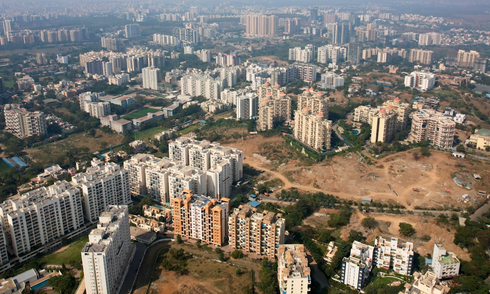 an aerial view of a city with lots of tall buildings