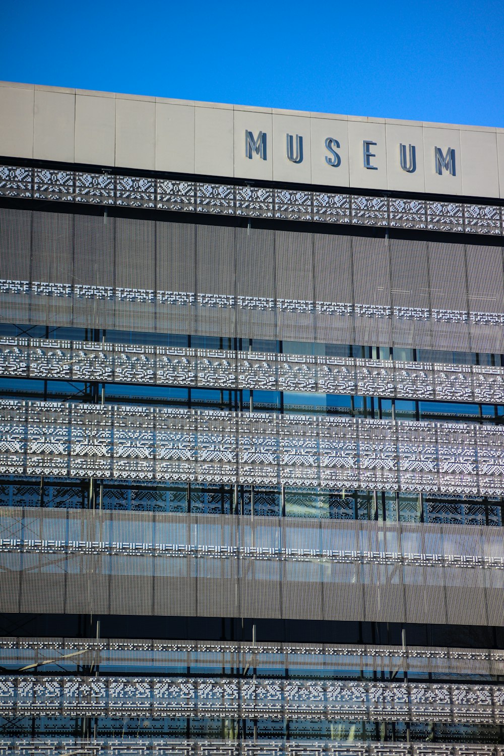 a tall building with a sign on top of it