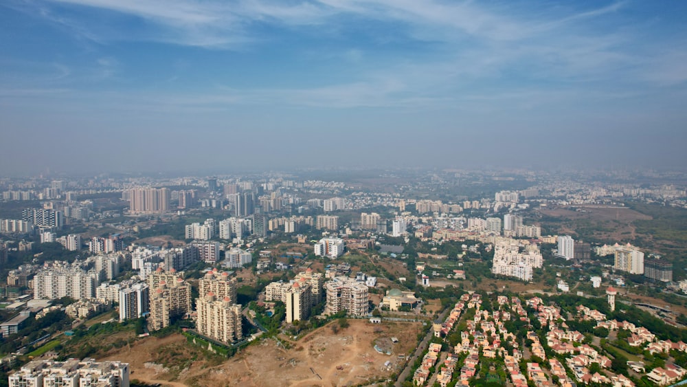an aerial view of a city with lots of tall buildings