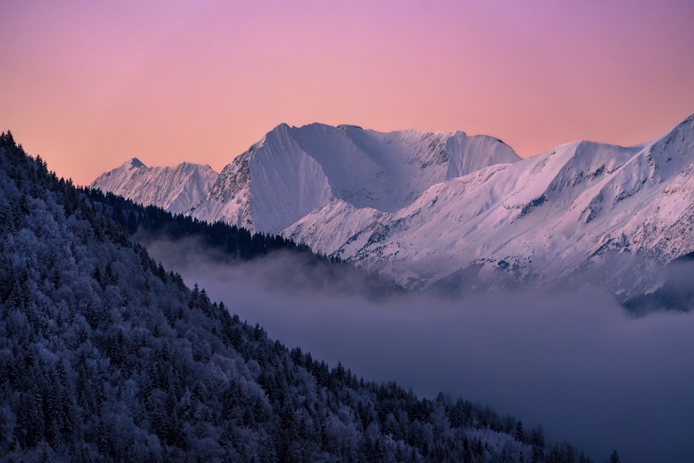 a view of a mountain range covered in snow