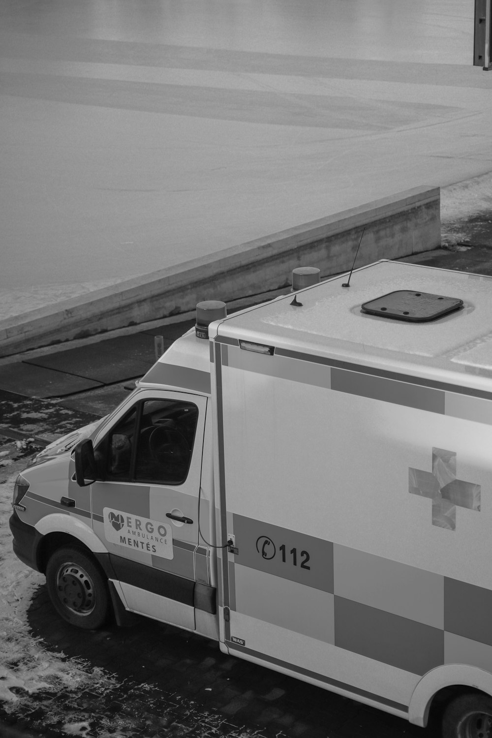 a black and white photo of an ambulance
