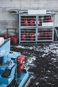 a bunch of red fire hydrants sitting next to each other
