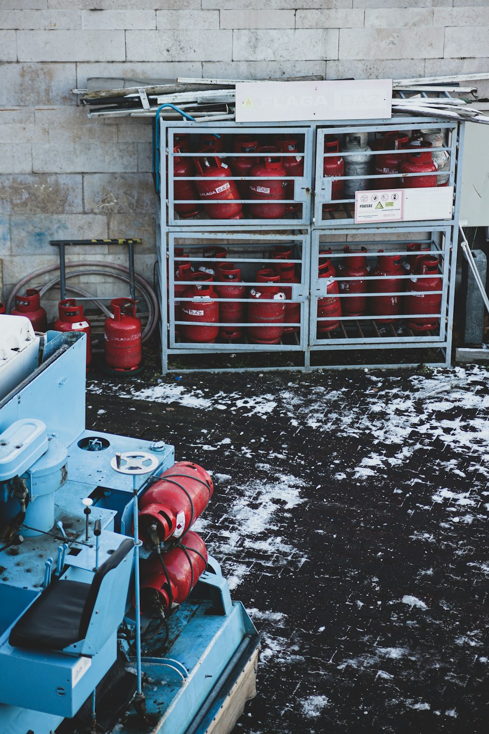 a bunch of red fire hydrants sitting next to each other