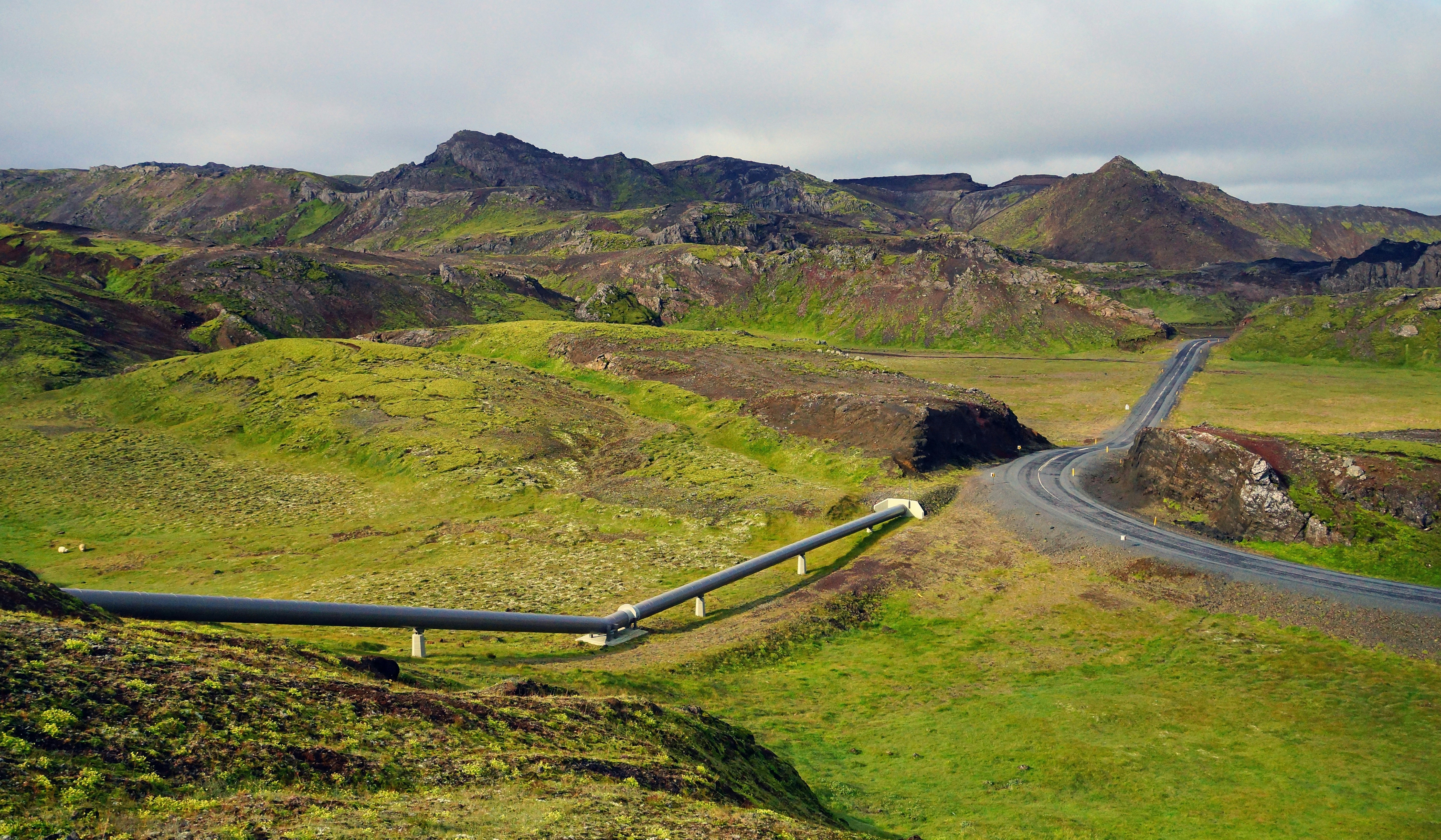 a winding road in the middle of a mountain range