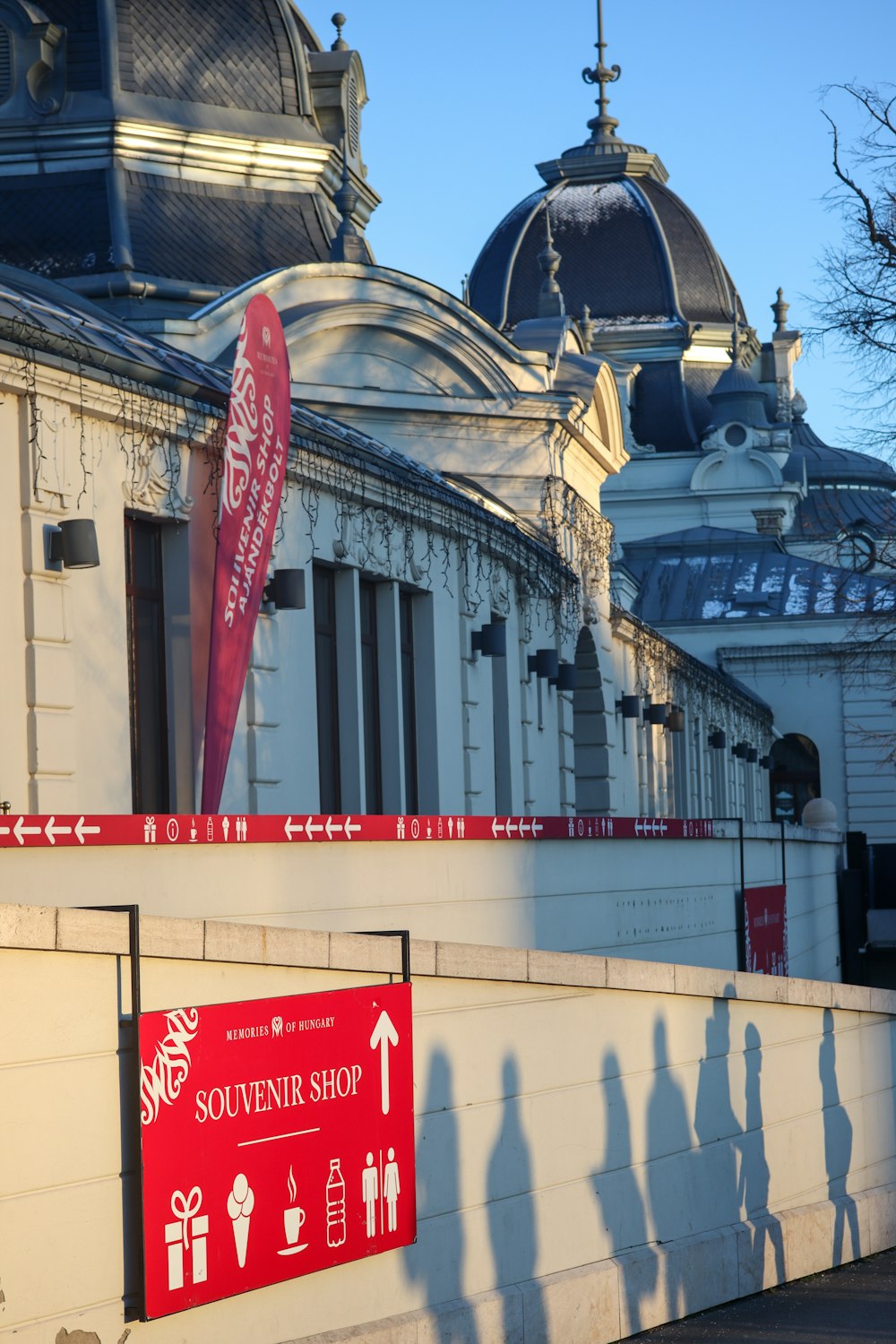 a building with a red sign in front of it