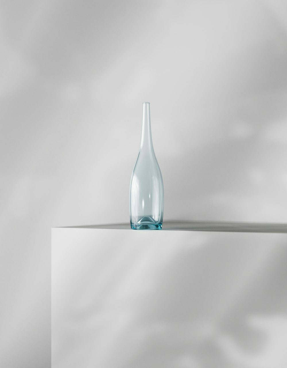 a glass bottle sitting on top of a table
