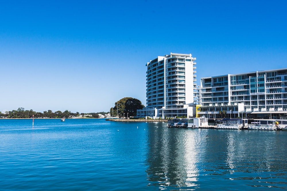 a body of water with a building in the background