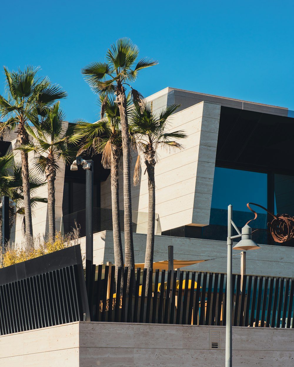 a building with palm trees in front of it