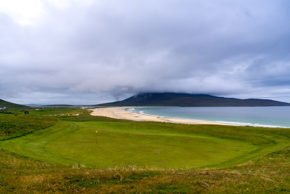 a view of a golf course on a cloudy day