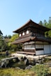 a building with a pond in front of it