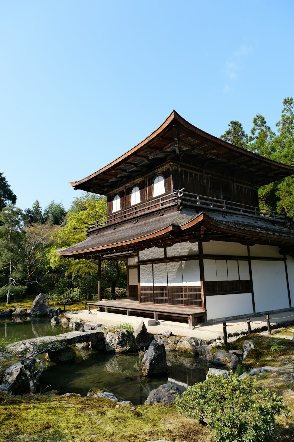 a building with a pond in front of it