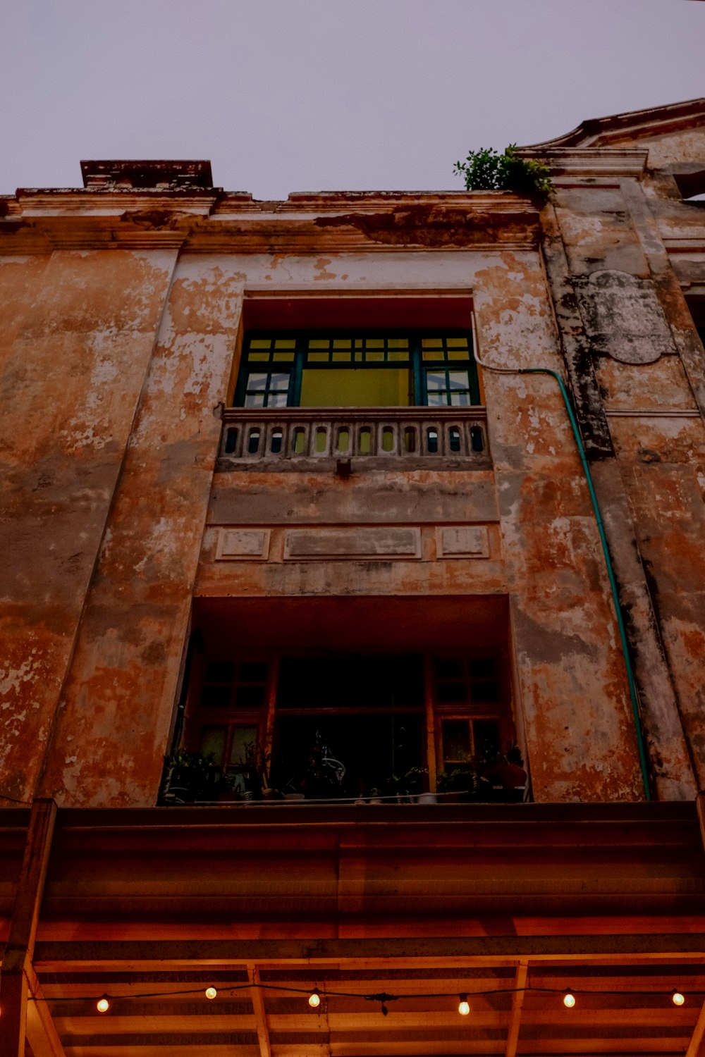 an old building with a clock on the front of it