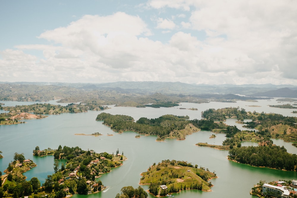 an aerial view of a lake surrounded by trees