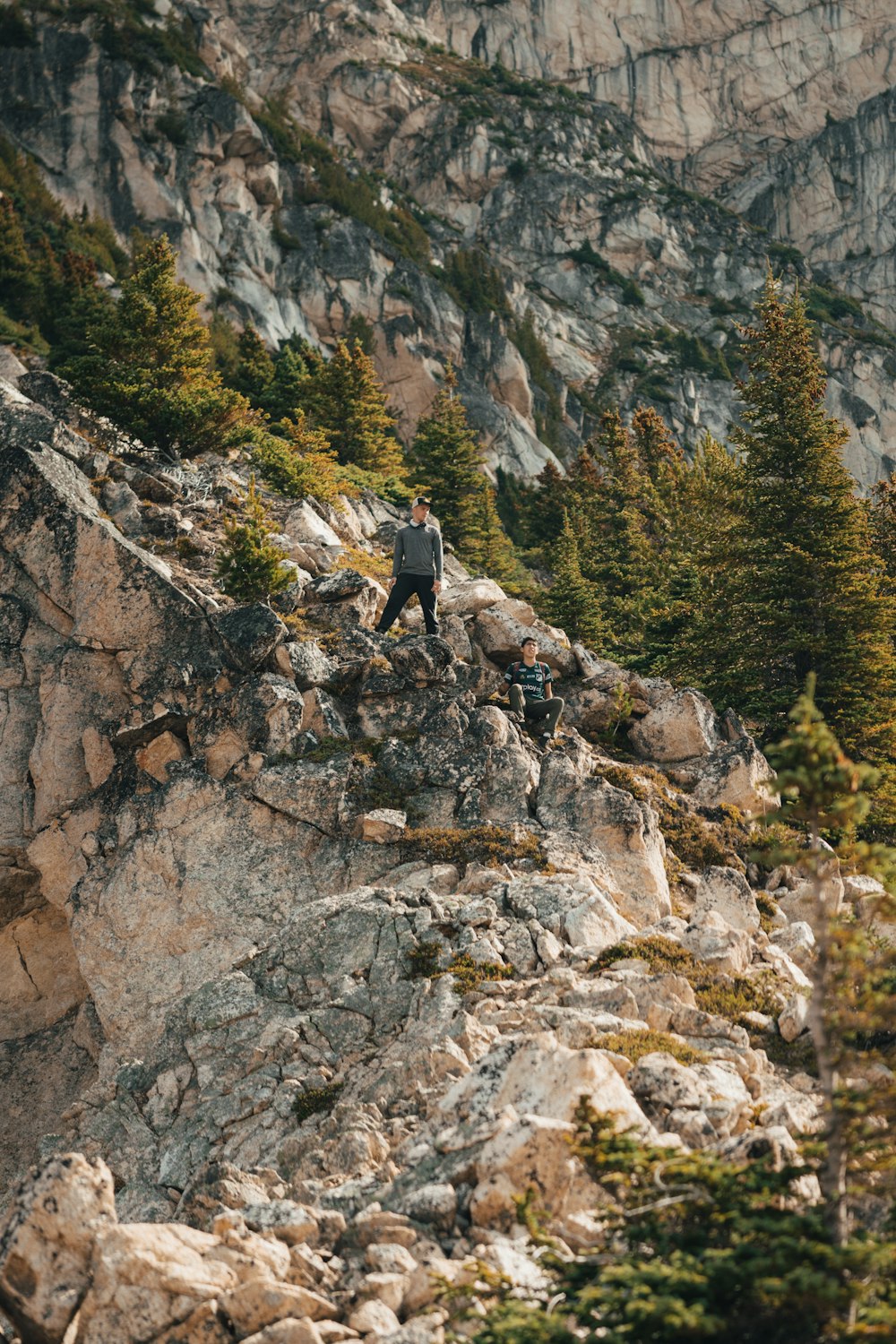 a man standing on top of a rocky mountain